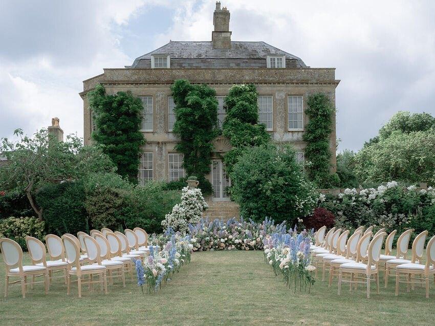 Ceremony on the front lawn before the house