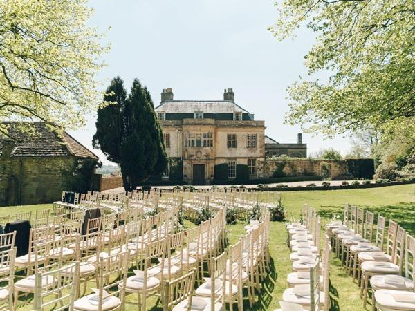 Ceremony chairs facing the house