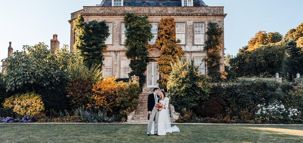 Couple in front of the house at golden hour