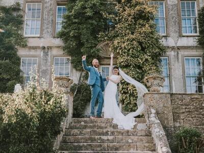 Couple cheering on the house steps