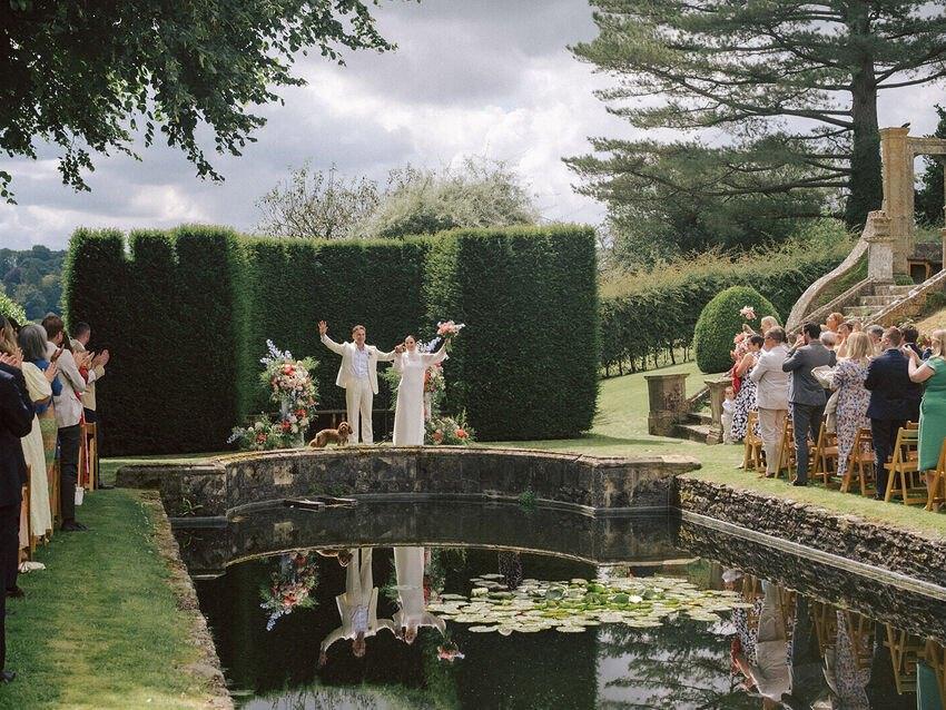 Ceremony by the water garden and yew hedge