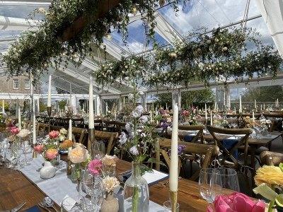 Marquee tables dressed with flowers