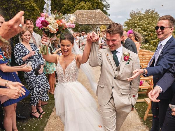 Couple walking through confetti